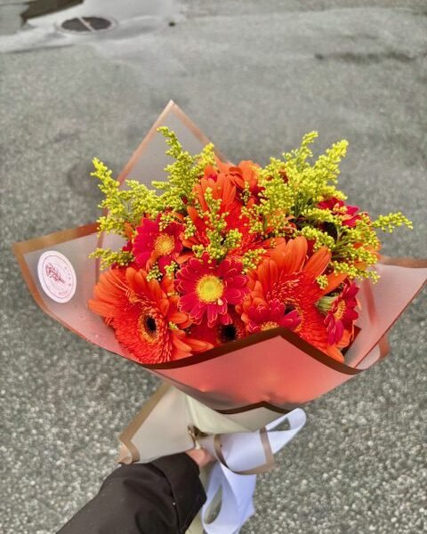 bright and cheerful bouquet of orange gerberas and yellow solidago for delivery in surrey BC