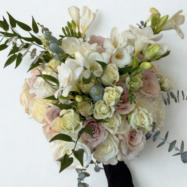 elegant pink and white bouquet with freesia and roses