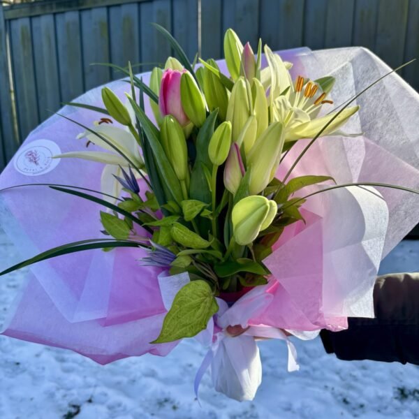 sympathy bouquet featuring pink tulips, and white lilies