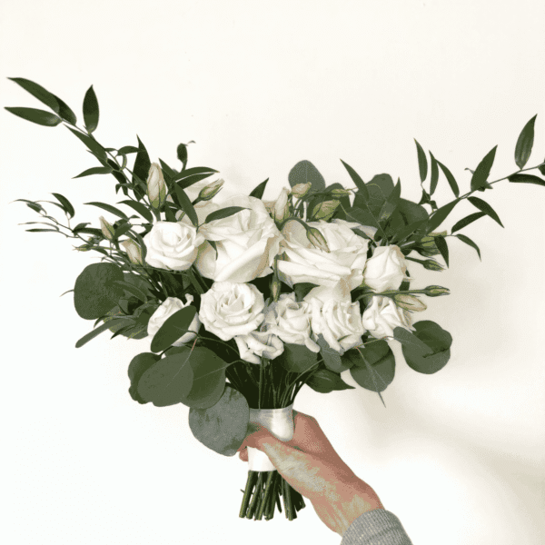 white rose and lisianthus bridal bouquet with fresh eucalyptus and Italian ruscus greenery